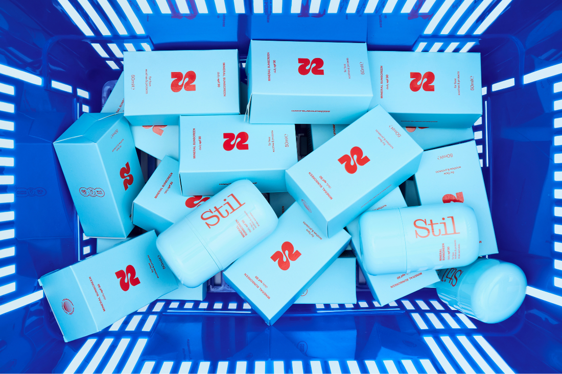 Shopping basket full of Stil Suncreen bottles