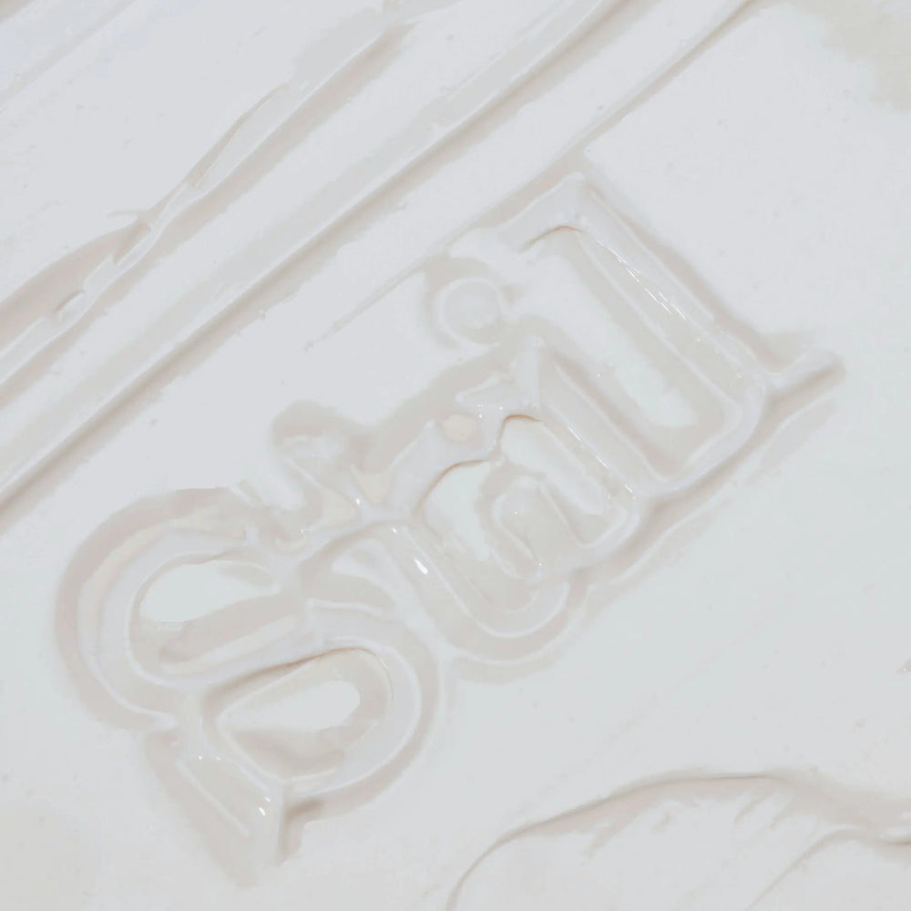 Close-up of a Stil cream, swatch.