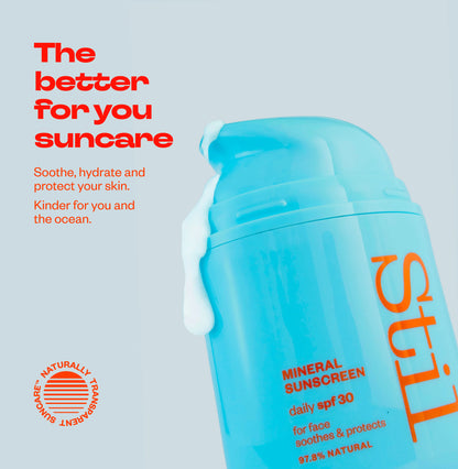 Stil Suncare bottle with orange text on a light gray background